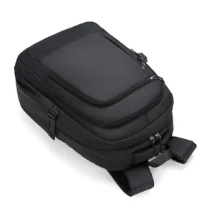 Close-up detail of the black grid backpack, showing durable fabric and sturdy zippers.