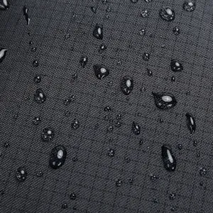 Waterproof backpack fabric detail texture close up view showing water resistant surface.