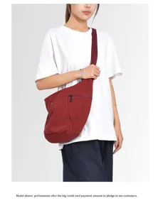 Detailed view of the slouchy crossbody dumpling bag, soft fabric and convenient zipper.