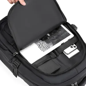 Detailed interior view of black business backpack with multi-compartments for organizing.