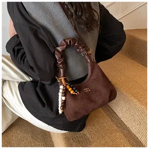 Vintage suede gathered dumpling handbag for women, chic shoulder crossbody bag with wooden beads.