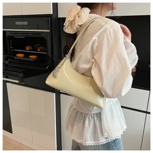 Stylish minimalist patent leather underarm shoulder bag with chic chain detail for daily commute.