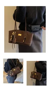 Detail shot of the brown commuting tote bag, featuring a metallic lock and large capacity interior.