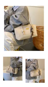 Detailed view of the stylish commuter shoulder bag with elegant turn-lock and side knot.