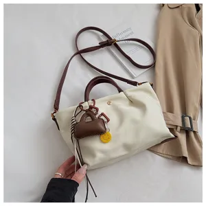 Stylish minimalist crossbody bag for women, versatile PU leather shoulder tote for daily commute.
