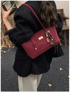 Stylish winter commuting shoulder bag, large capacity tote with chic turn-lock and charms.