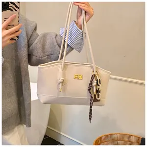 Casual commuter women shoulder tote bag with stylish turn-lock and chic charm detail.