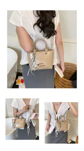Retro textured patent leather handbag for women, chic crossbody shoulder bag with metal charms.