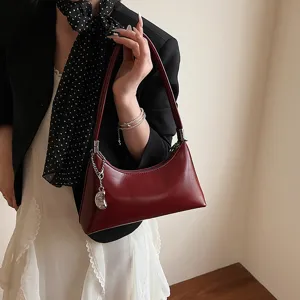 Retro underarm shoulder bag for women, stylish pillow handbag, trendy commuting purse.