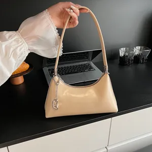 Elegant minimalist beige PU leather shoulder hobo bag for women, chic daily commuter handbag.