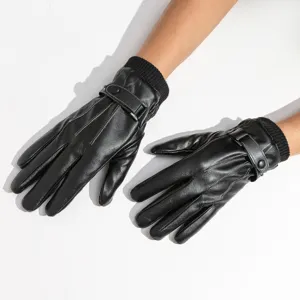 Close-up detail of black PU leather touchscreen gloves with warm knitted cuffs and buckle.