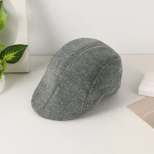 Detailed close-up view of a grey linen flat cap, showing fine fabric texture and classic style.