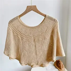 Summer hollow-out knitted cape for women, elegant beach sunscreen shawl and stylish outerwear.