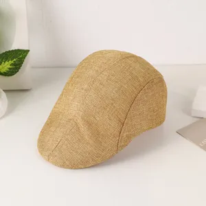 Close-up view of a stylish faux linen flat cap, showing fine woven texture and classic design.
