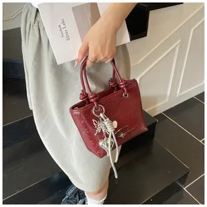 Vintage textured burgundy small handbag for women, stylish autumn crossbody tote bag with charms.