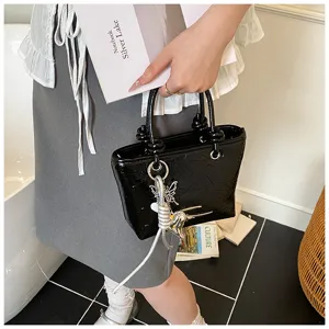 Black patent leather handbag for women, vintage style tote bag with cute charms and knot handle.
