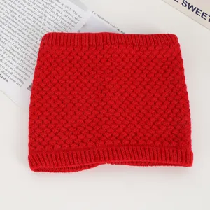 Detailed close-up view of the cozy red knitted winter neck warmer showing soft texture.