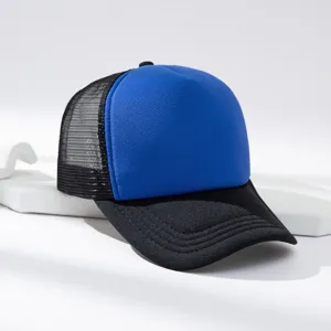 Detail view of color-blocked trucker hat with breathable mesh back and blue foam front panel.