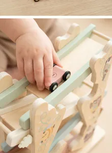 Wooden track toy detail view, close up of cute mini car on sliding ramp, smooth wood finish.