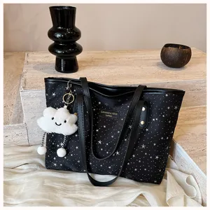 Black star print tote bag for women featuring cute cloud pendant and double handles.