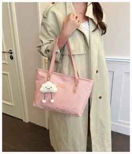 Charming pink star tote bag for women with cute cloud charm, stylish large capacity handbag.