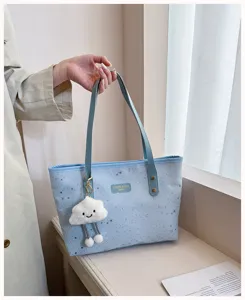 Light blue star print tote handbag featuring cute cloud charm, elegant design and large capacity.
