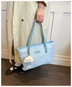 Light blue star print tote bag featuring double handles and a cute fluffy cloud charm detail.