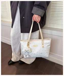 Fashion casual large capacity star print tote bag with cute cloud charm for women.