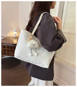 Stylish women tote bag with starry pattern and cute cloud charm, large capacity for daily use.