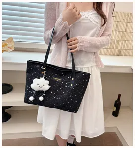 Fashionable large capacity black star print tote handbag with cute plush cloud pendant.