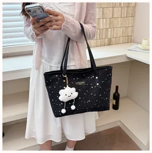 Black star pattern tote bag with cute cloud pendant, large capacity stylish handbag for women.