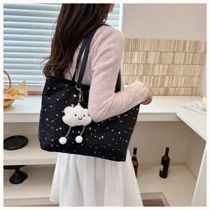 Large capacity women tote handbag with star print and cute cloud charm for casual daily use.