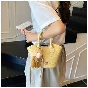Summer woven small handbag for women, cute bear pendant tote bag, detail view showcasing style.
