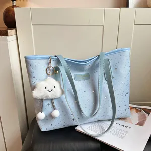Fashionable light blue tote bag with silver star pattern and cute cloud plush keychain for women.