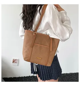 Brown woven tote bag for women, large capacity casual shoulder bag with front pocket.