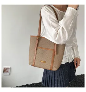 Casual woven shoulder tote bag for women, large capacity stylish daily handbag with brown handles.