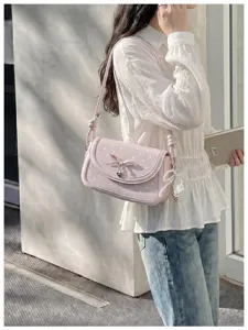 Pink polka dot shoulder bag with cute bow and pearl charm, stylish Korean style handbag.