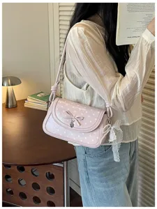 Korean style cute polka dot shoulder bag with bow, sweet design handbag for women daily commute.