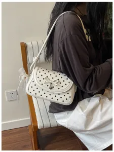 Sweet polka dot shoulder bag with cute bow detail, stylish casual handbag for women daily use.