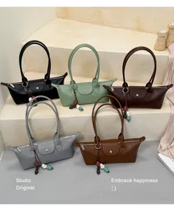 Minimalist women's underarm shoulder bag, stylish commuter PU leather handbag for summer.