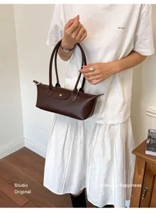 Elegant brown leather shoulder bag for women, chic minimalist commuter handbag with dual handles.