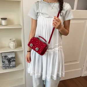Red polka dot crossbody bag for women, retro style shoulder handbag with top handle.