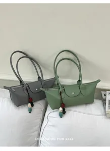 Stylish minimalist east-west shoulder bag for women, trendy commuting PU leather handbag.