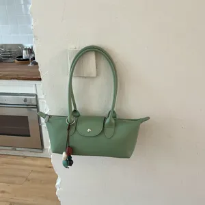 Green PU leather underarm shoulder bag for women, stylish casual commute tote bag.