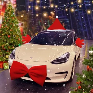 Detail view of Christmas car decoration set featuring giant red bow, Santa hat, and mirror covers.