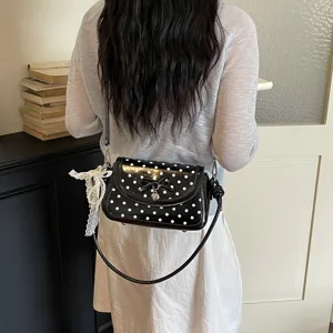 Black and white polka dot shoulder bag for women, sweet bow patent leather crossbody bag.