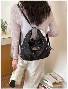 Sac à dos noir imprimé étoiles avec nœud brillant, sac cabas polyvalent pour femmes au quotidien.