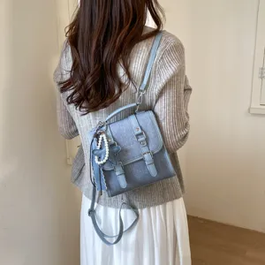 Sac à dos mini en denim bleu tendance pour femme, cartable rétro décontracté avec pendentif étoile.