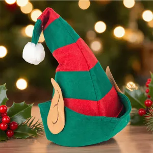 Close-up of red and green striped Christmas elf hat with cute ears and fluffy pom-pom for party.