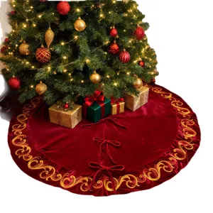 Red velvet Christmas tree skirt with gold scroll embroidery and sequins for holiday party decor.